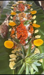 a plate of food on a banana leaf at A&Z Nagtabon Lodge in Bacungan