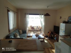 a living room with a couch and a table at Bramer 6 Canyelles in Roses