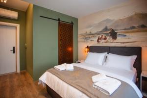 Uma cama ou camas num quarto em Hotel Flaer