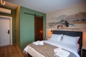 Uma cama ou camas num quarto em Hotel Flaer