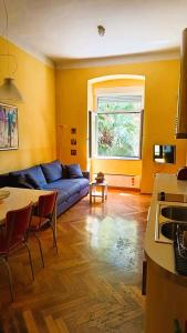 a living room with a couch and a table at Apartment Colors of Life in Rijeka