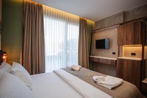 Uma cama ou camas num quarto em Hotel Flaer