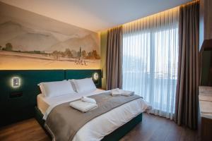Uma cama ou camas num quarto em Hotel Flaer