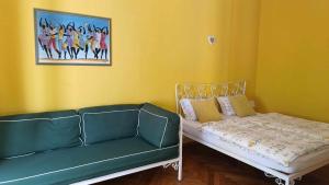 a couch and a bed in a room at Apartment Colors of Life in Rijeka