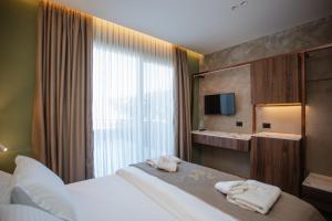 Uma cama ou camas num quarto em Hotel Flaer