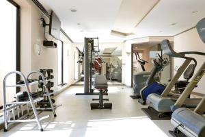 a gym with treadmills and elliptical machines at Apart-hotel 1804 - Le Premier Suítes Jardim Paulista in Sao Paulo