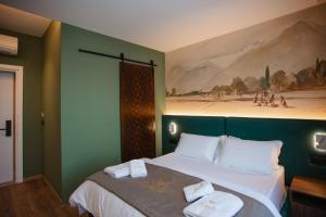 Uma cama ou camas num quarto em Hotel Flaer
