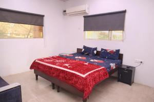 A bed or beds in a room at RAHA FARM