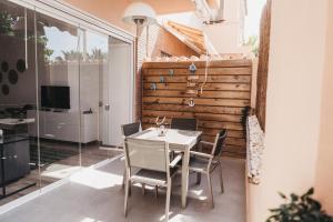 a dining room with a table and chairs at Biasa Holidays in Torrox Costa