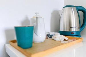 a cutting board with a coffee maker and a blender at Luxury Suite 3 in Himara in Himare +4 photos