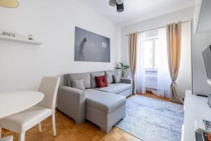 a living room with a couch and a table at Charming suite with view in the heart of Rome in Rome +20 photos