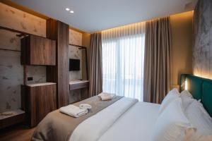Uma cama ou camas num quarto em Hotel Flaer