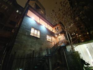 a building with stairs and lights on it at night at Doss Guest Hause in Yerevan