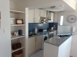 Η κουζίνα ή μικρή κουζίνα στο Cuyen 1 Pleno Centro +8 φωτογραφίες