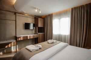 Uma cama ou camas num quarto em Hotel Flaer