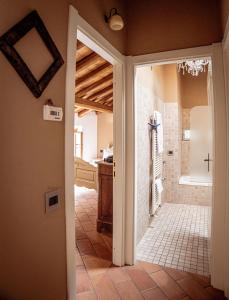 a bathroom with a walk in shower and a tub at Lake View 16 in Laglio