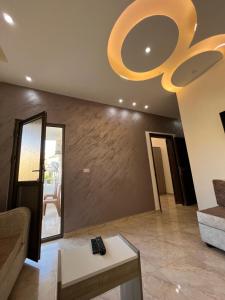 a large living room with a large ceiling fan at Petra Heaven Boutique in Wadi Musa
