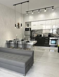 a large kitchen with a table and chairs in it at LT Apartment in Vratsa