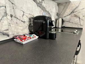 a coffee maker on a counter in a kitchen at LT Apartment in Vratsa