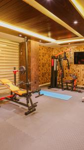 a gym with two treadmills and two exercise bikes at Granada Hotel in An Najaf