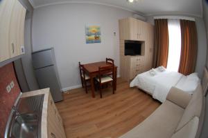 TV i/ili multimedijalni sistem u objektu Hotel Vila Alvin & Apartments