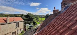 an overhead view of the roofs of buildings at LetAway - The Curtain (13th Century Cottage) in Richmond