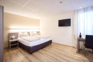 Katil atau katil-katil dalam bilik di Smart Hotel Kreisel --Self check-In