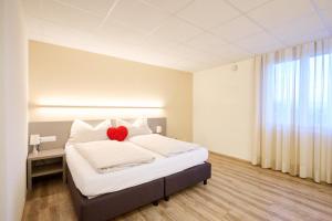 Katil atau katil-katil dalam bilik di Smart Hotel Kreisel --Self check-In