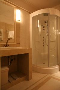 a bathroom with a shower and a sink at Hotel Villa Viktorija in Banja Luka