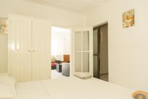 Postel nebo postele na pokoji v ubytování Tahiti Hotel