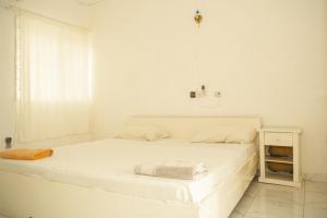 Postel nebo postele na pokoji v ubytování Tahiti Hotel