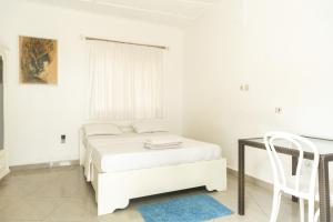 Postel nebo postele na pokoji v ubytování Tahiti Hotel