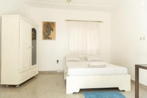 Postel nebo postele na pokoji v ubytování Tahiti Hotel