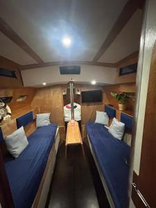 a small room with two beds in a boat at LA REGINA in Lido di Ostia