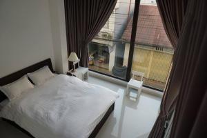 Postel nebo postele na pokoji v ubytování Xuan Cuong Hotel