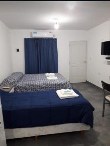 Ένα ή περισσότερα κρεβάτια σε δωμάτιο στο La Chacarita apart