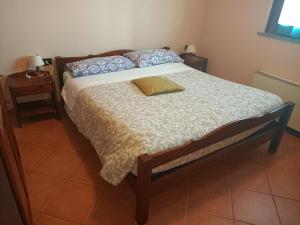 מיטה או מיטות בחדר ב-Agriturismo Vecchio Torchio