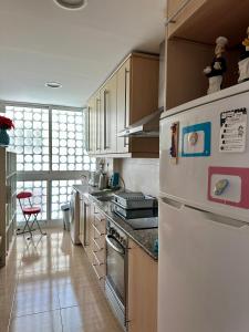 Kuchyň nebo kuchyňský kout v ubytování Apartamento frente al Mar