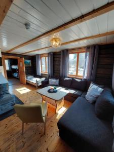 a living room with a couch and a table at STORHAUGEN GARD in Lom