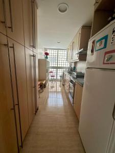 Kuchyň nebo kuchyňský kout v ubytování Apartamento frente al Mar