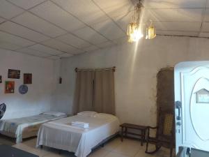 En eller flere senge i et værelse på Hostal Brisas del Ometepe