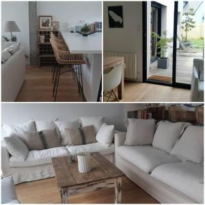 sala de estar con sofá blanco y mesa en Une maison en ville - Jardin - Au calme en Lorient