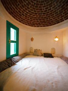 Ein Bett oder Betten in einem Zimmer der Unterkunft Douira S+1
