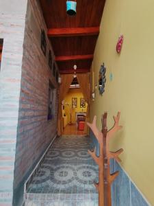 a hallway of a home with a wooden ceiling at Hospedaje Miguel in Maimará