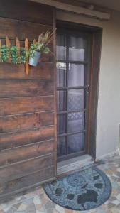 a door to a house with a potted plant on it at Jardin Imperial in Mexicali