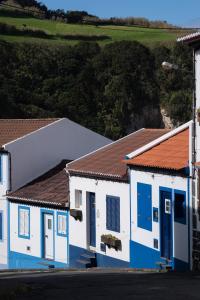 an aerial view of two buildings with blue and white at Casa Da Praia in Porto Formoso