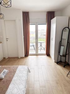Postel nebo postele na pokoji v ubytování Danin apartmani
