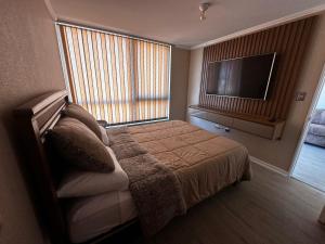Postel nebo postele na pokoji v ubytování Departamento en Ulriksen