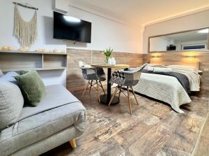 Una cama o camas en una habitación de Apartamenty Marea Rentals Beniowskiego Ustka