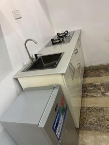 A cozinha ou kitchenette de Cozy Studio in Asokoro+fast WiFi